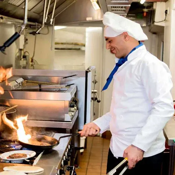 Maple Ridge Chef Created Meals, chef frying a dish.