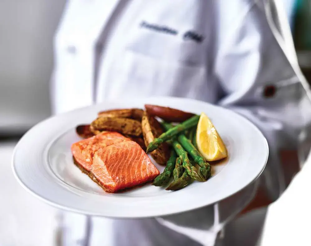 Maple Ridge Chef Created Meals, chef delivering a finished dish.