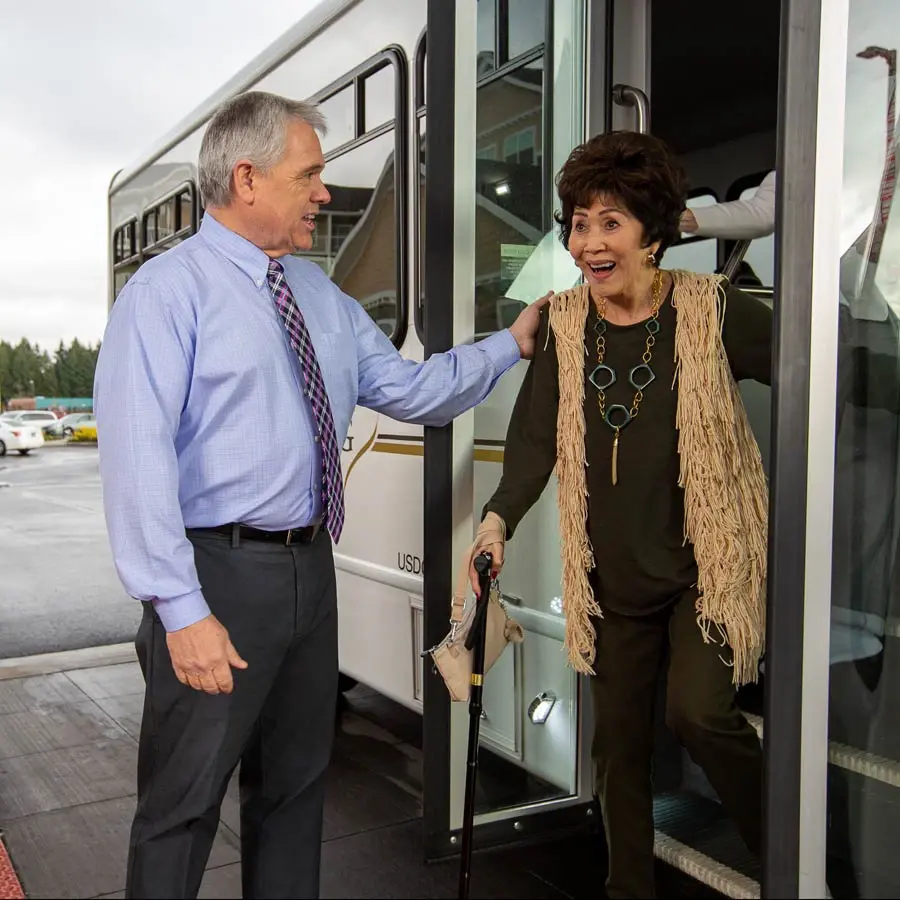 Maple Ridge man helping lady off bus